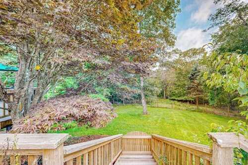 Charming 2-story house near the beach with inviting deck, large yard & canoe