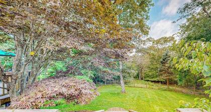 Charming 2-story house near the beach with inviting deck, large yard & canoe
