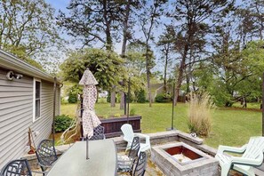 Outdoor dining - Relaxing family retreat with patio, bikes, fire pit, grill, & central AC (West Yarmouth)
