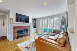 TV, fireplace, DVD player, offices - Spacious coastal retreat close to beach with modern kitchen, deck, AC, & sunroom (Yarmouth)
