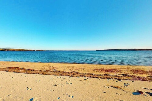 Dog-friendly coastal home steps from beach with grill, firepit, & washer/dryer