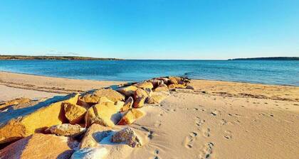 Dog-friendly coastal home steps from beach with grill, firepit, & washer/dryer