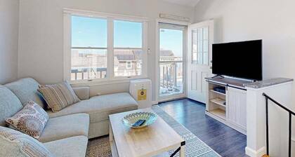 Two-story condo with ocean views, parking, & private balcony