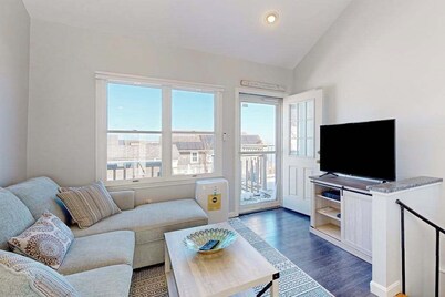 Two-story condo with ocean views, parking, & private balcony