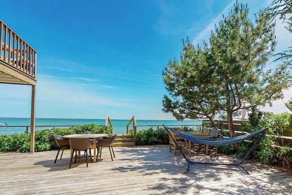 Outdoor dining - Renovated beachfront condo on Cape Cod Bay with deck & gorgeous views (Provincetown)