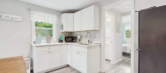 Private suite with roof deck, near golf, bus stop, shops, and trails