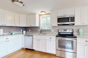Fridge, microwave, oven, stovetop - Renovated, river view home with yard games - walk to town dock & beach (West Dennis)