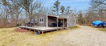 Quaint home across from bike paths with large furnished deck, grill, & W/D