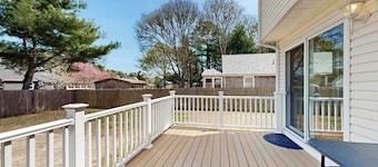 Charming coastal home with sunny rooms, private backyard, & walk to beach