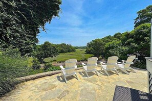 Terrace/patio - Peaceful marshview escape with large sunroom, AC, outdoor firepit & dog friendly (Pocasset)