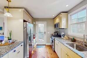 Fridge, microwave, oven, stovetop - Relaxing vacation home close to the beach with three-season porch, grill & patio (Provincetown)