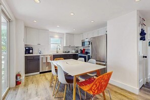 Fridge, microwave, oven, stovetop - Second-floor condo steps from downtown with large deck, partial bay view & AC (Provincetown)