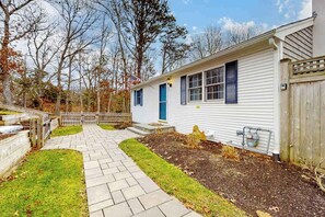 Property grounds - Tranquil & sunlit home with peaceful yard, large deck, & fireplace - near beach (Orleans)