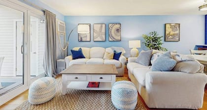 Modern fairway condo with open layout, private patio, AC & washer/dryer