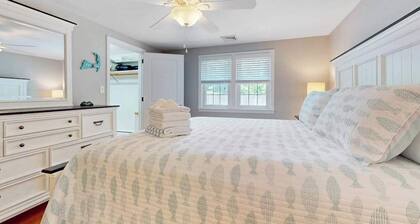 Charming coastal home near pond with sunroom, open layout, yard & AC