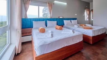 Suite, 2 Schlafzimmer, Balkon, Gartenblick | Schreibtisch, kostenloses WLAN, Bettwäsche