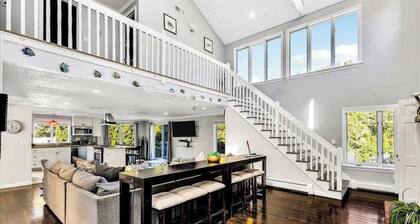 Spacious coastal retreat with heated pool, kayaks, game room & pond views