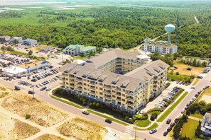 Exterior - Second-floor, ocean view condo with balcony, foosball, WiFi & on-site pool/gym (Virginia Beach)