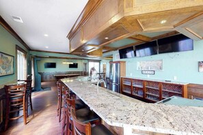 A spacious kitchen with a large island, wooden cabinets, and stainless steel appliances. - Wonderful beachfront home w/private indoor & outdoor pools, WiFi, AC, deck (Virginia Beach)