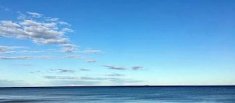 Ocean-view home that is within a 2 minute walk to the beach w/rooftop deck