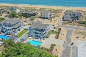 Exterior - Spacious home across from the beach with partial ocean views, pool, & pool table (Virginia Beach)