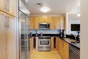 Fridge, microwave, oven, stovetop - Inviting condo steps from the beach with balcony & resort pools (Virginia Beach)