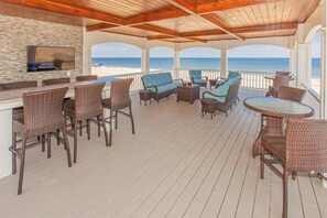 Outdoor dining - Oceanfront vacation gem w/private indoor & outdoor pools, WiFi, central AC, W/D (Virginia Beach)