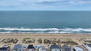 A coastal property with multiple buildings, a sandy beach, and the ocean. - 9BR home with private pool, hot tub & 4 min to beach, free WIFI (Virginia Beach)