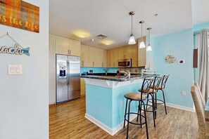 Fridge, microwave, oven, stovetop - Coastal corner condo with poolview balcony, resort pools & walking path to pier (Virginia Beach)