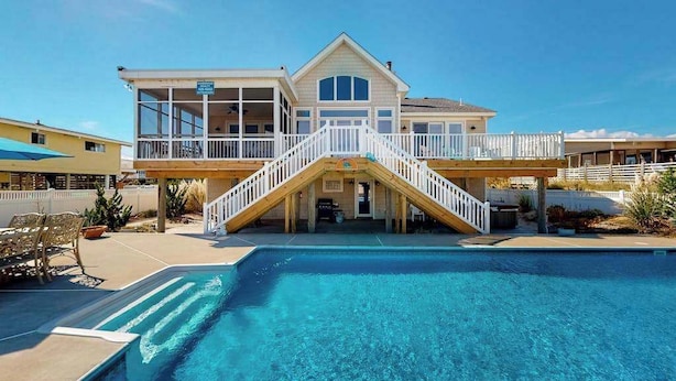 A two-story house with a pool in front. - Fantastic oceanfront home w/private pool & hot tub, WiFi, central AC, & deck (Virginia Beach)
