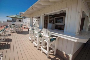 Outdoor dining - Oceanfront home with pool, hot tub, central AC, & furnished deck - near shopping (Virginia Beach)