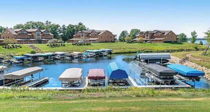 Golf course-front condo with pool, hot tub, dock, tennis, golf, & private beach