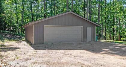 Gorgeous lake home with private pier, beach, firepit, deck, & grill + water toys