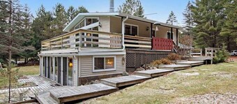 Lakefront Home with a Private Dock, Deck, Fireplace, Spacious Yard, & Playset