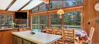 Lakefront Home with a Private Dock, Deck, Fireplace, Spacious Yard, & Playset