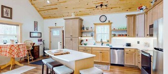 Lakefront home with, dock, kayaks, paddle boards, fire pit & more