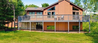 Golf course-front home with 2 pools, private beach, boat launches, tennis, grill