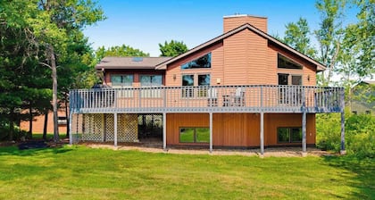 Golf course-front home with 2 pools, private beach, boat launches, tennis, grill