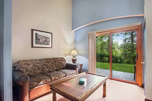 Ground-floor condo with mini-fridge, central AC, & patio