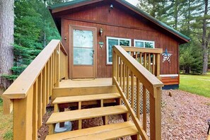 Exterior detail - Lakefront cottage w/ a dock, shared furnished patio, firepit, & a paddleboat (Eagle River)