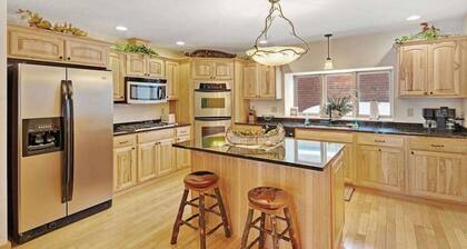 Waterfront townhome with fireplace, private patio, & shared boat docks