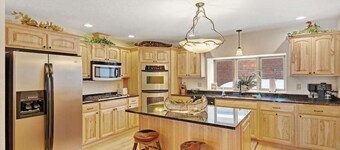 Waterfront townhome with fireplace, private patio, & shared boat docks