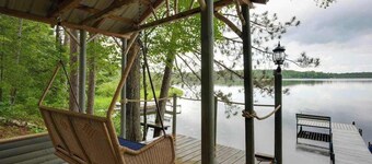 All-seasons lakefront cabin with dock, wood fireplace, kitchen, kayaks, & AC