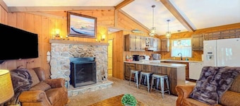 All-seasons lakefront cabin with dock, wood fireplace, kitchen, kayaks, & AC