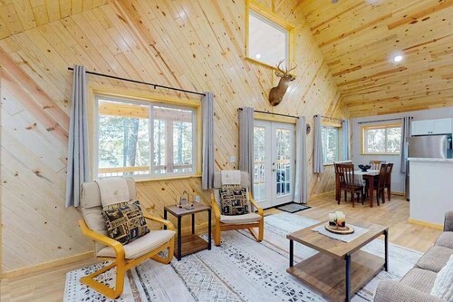 Dog-friendly, lakefront getaway with a firepit, dock, washer/dryer, & AC