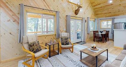 Dog-friendly, lakefront getaway with a firepit, dock, washer/dryer, & AC