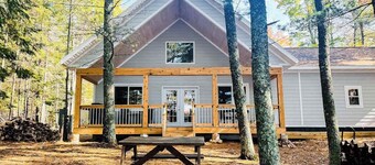 Dog-friendly, lakefront getaway with a firepit, dock, washer/dryer, & AC