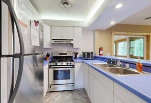 Fridge, microwave, oven, stovetop - Dog-friendly home near Petenwell Lake - gas grill & outdoor dining area (Necedah)