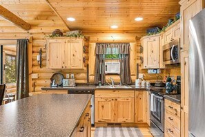 Fridge, microwave, oven, stovetop - Riverfront cabin with a dock, kayaks and a canoe - firepit and water views (Lyndon Station)