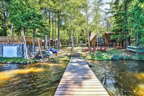 Property grounds - Charming, lakefront home with a gas fireplace, docks, firepit, & full kitchen (Eagle River)